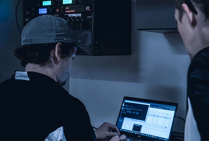 A Gamma Tech technician helping a client with a laptop
