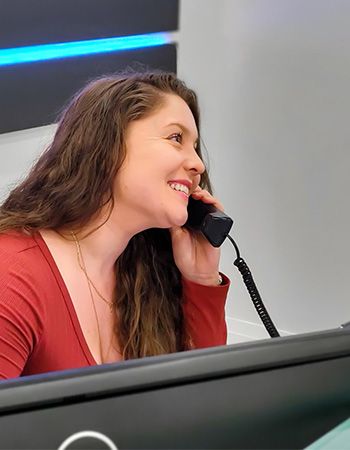 A Gamma Tech client answering a business phone call