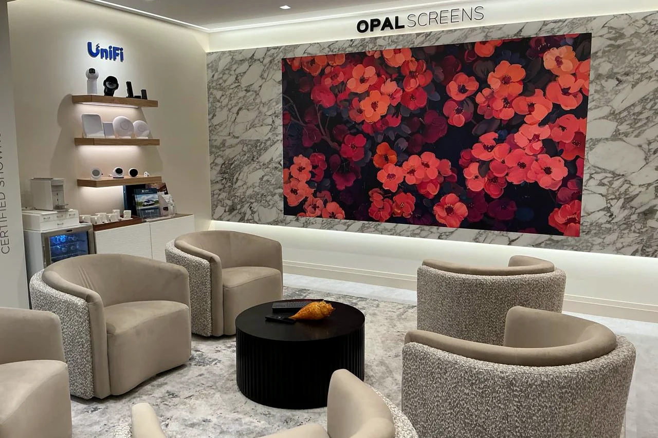 The Invisible Theater in Gamma Tech’s Naples showroom, with an Opal Screens video wall showing art