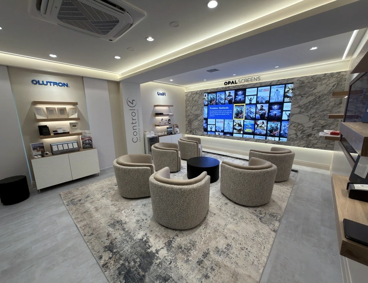 The Gamma Tech Experience Center in Naples, with Lutron, Control4 and UniFi displays and an Opal video wall