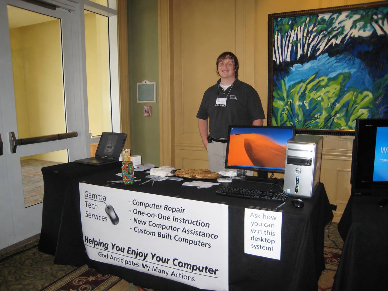 Bradd at an early Gamma Tech Services booth offering computer repair, one-on-one instruction and custom-built computers