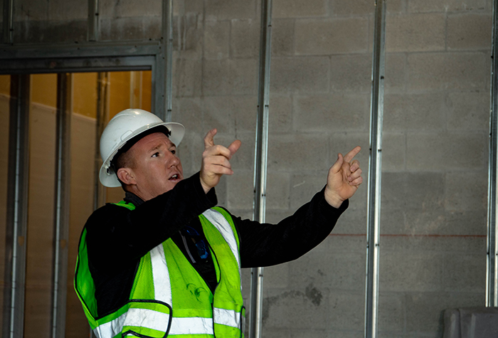 Gamma Tech Services technician giving instructions using his hands