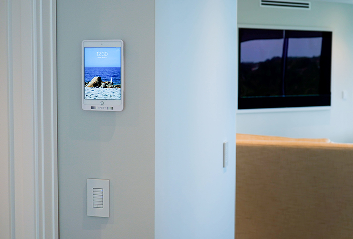 iPad installed on a wall for a smart home automation system