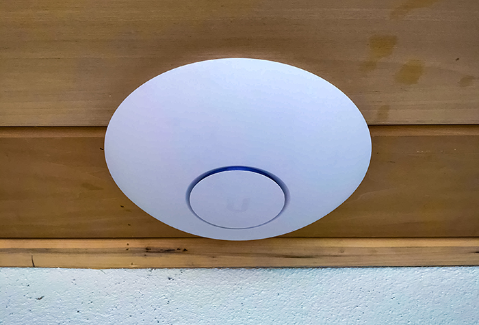 Ubiquiti UniFi access point on a ceiling installed by Gamma Tech Services