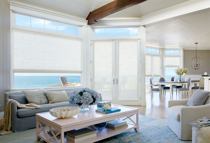 Motorized shades with ocean in view