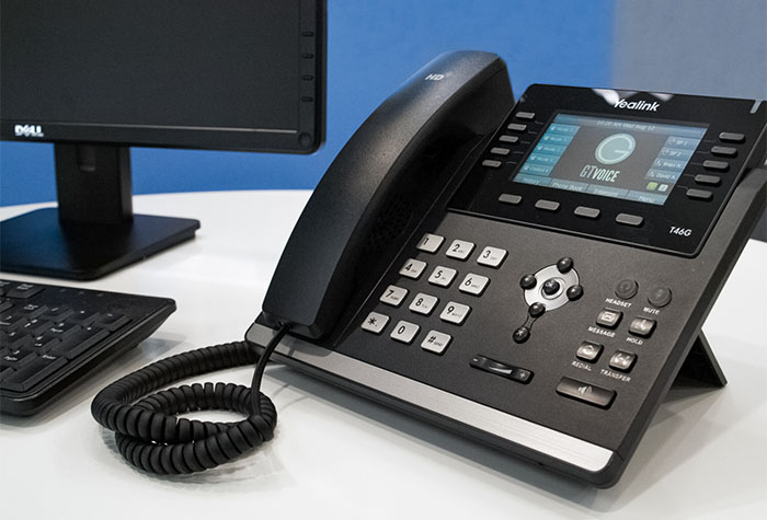 VoIP Phone with GTVoice logo on display screen