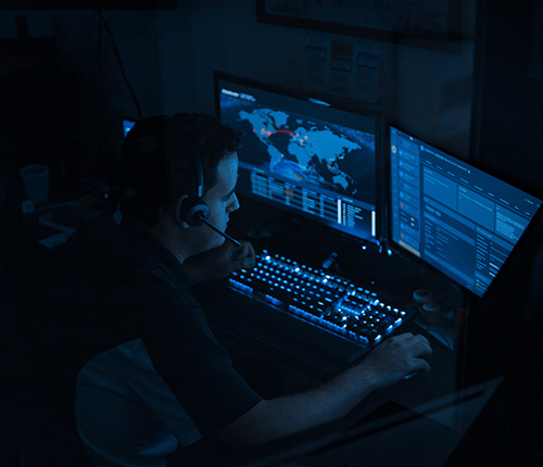 Gamma Tech I.T. and Cybersecurity technician working on a computer