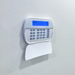 Security alarm mounted on wall
