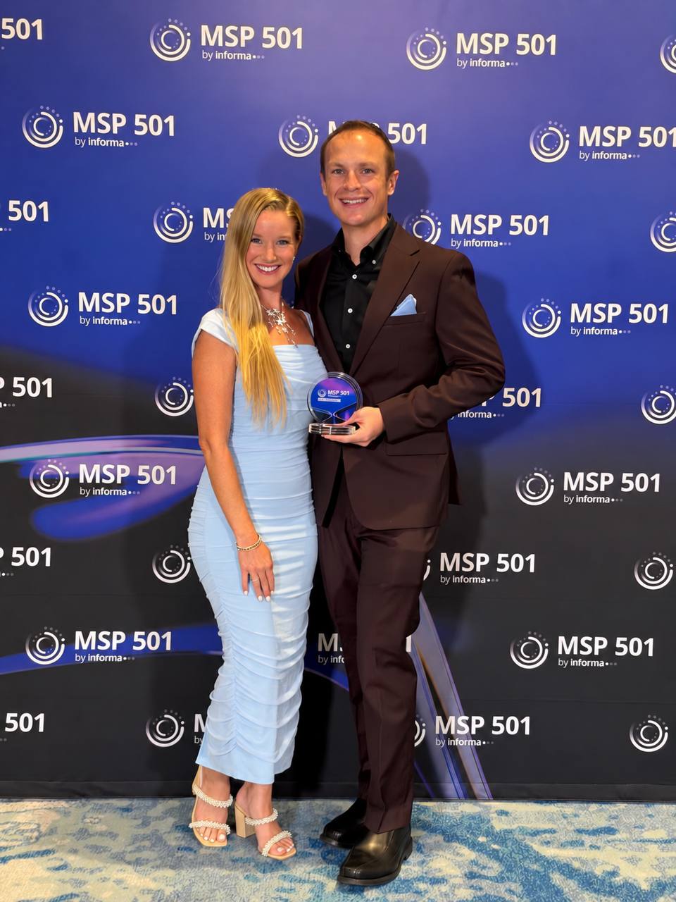 Celebrating Gamma Tech’s MSP 501 recognition with an award at the gala